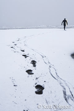 Snowy winter surf session in Alaska.