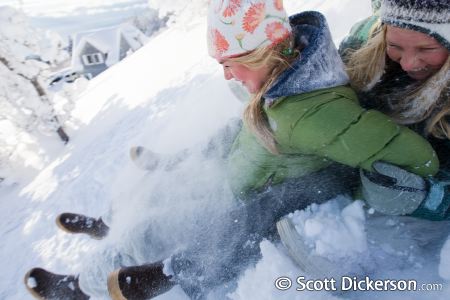 Sledding teens