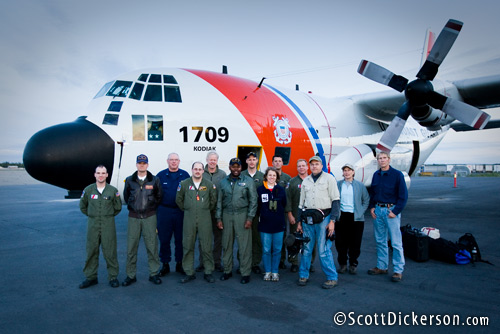 Group photo of the people involved in a cooperative effort to search for swimming polar bears in the Chukchi Sea, Arctic Alaska. The Coast Guard Air Station Kodiak C-130 carried the searchers on the mission.