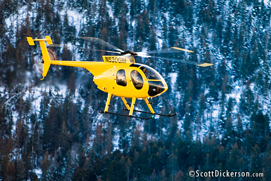 air to air aerial photo of MD 530 helicopter in flight