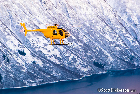 air to air aerial photo of MD 530 helicopter in flight