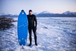 surfer on ice in Alaska