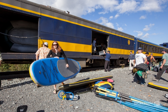 unloading inflatable stand up paddleboards from the Alaskan Railroad 